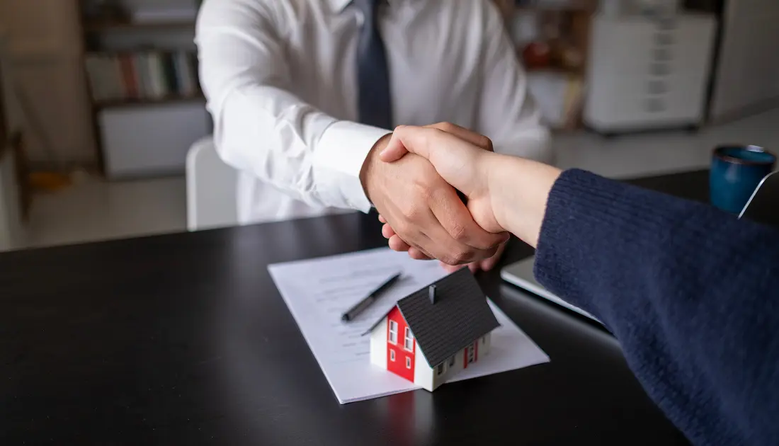 Handshake over a real estate contract