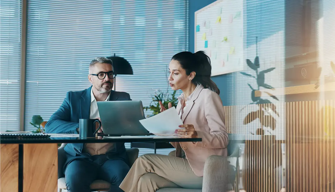 Professionals analyzing documents together