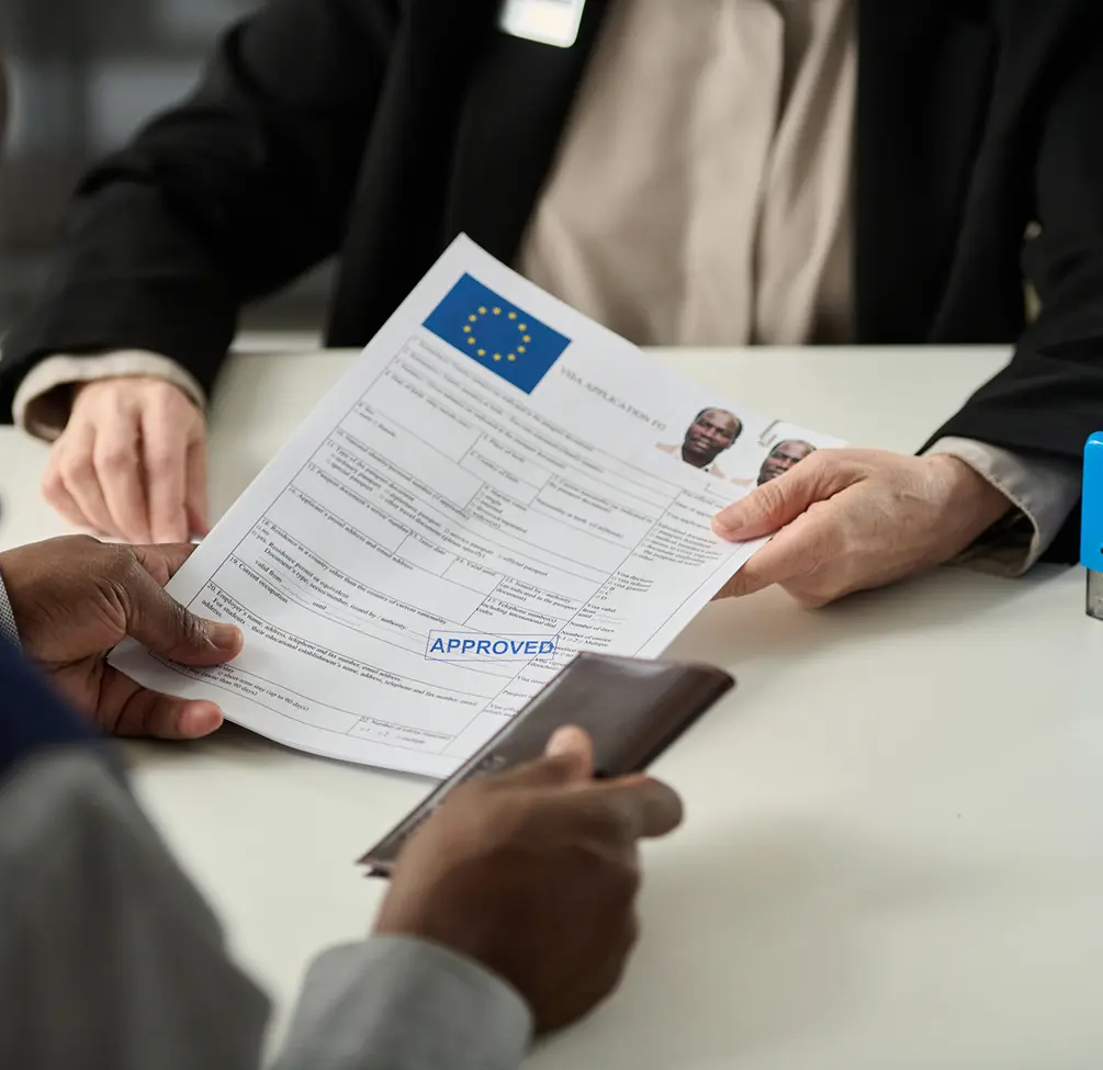 Approved visa application being handed over