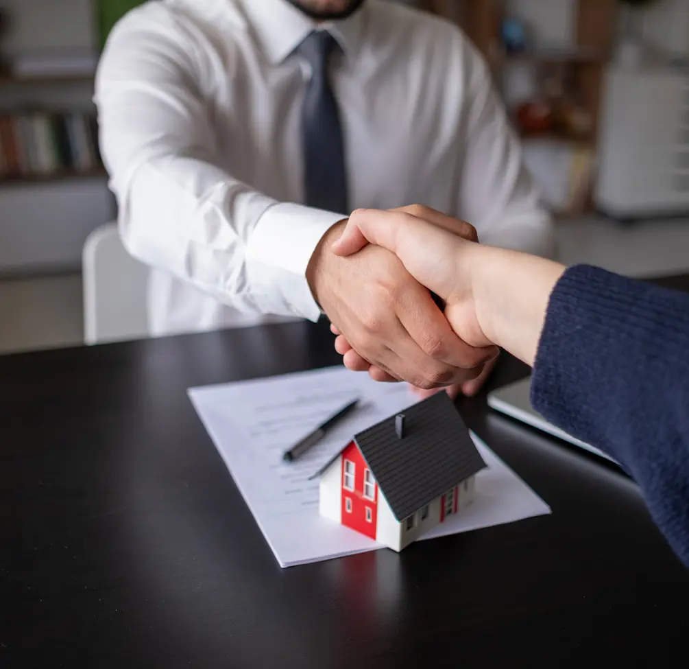 Business deal with miniature house