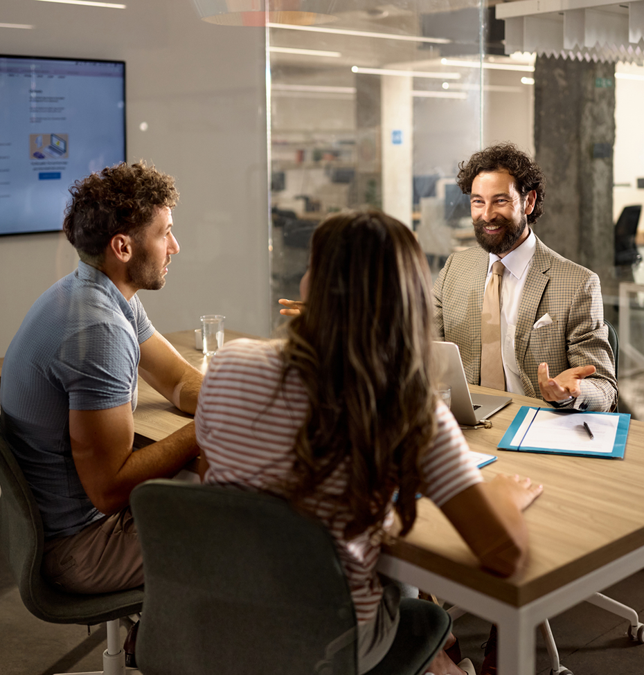 Smiling professional with colleagues at table